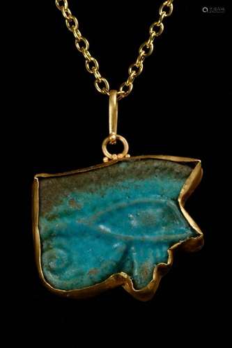 EGYPTIAN FAIENCE WEDJAT-EYE AMULET IN LATER GOLD PENDANT