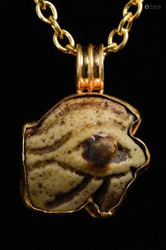 EGYPTIAN FAIENCE WEDJAT-EYE AMULET IN LATER GOLD PENDANT