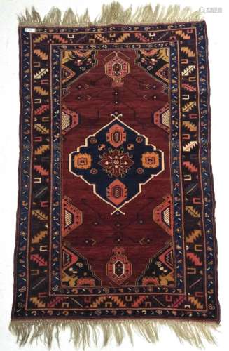 Old Caucasian Wool Rug. Red ground with geometric central me...