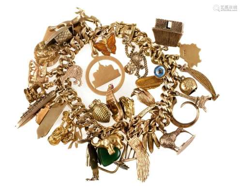18ct Yellow Gold Charm Bracelet. Double curb link - with 34 ...