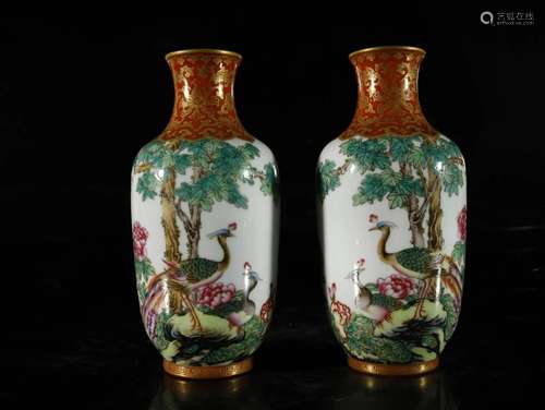 A pair of famille-rose painted gold vases