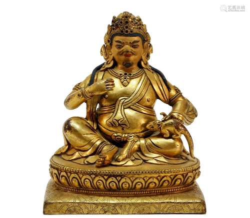 An excellent Tibetan gilt bronze money god statue