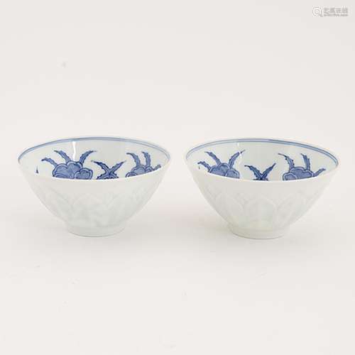 A pair of Chinese blue and white eggshell cups, presumably R...