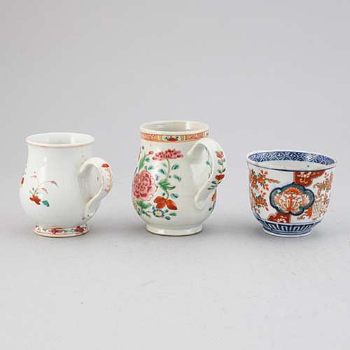 Two famille rose export porcelain jugs and a Japanese Imari ...