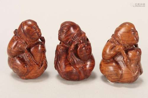 Three Japanese Carved Wooden Netsuke,