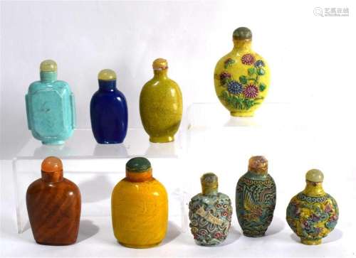 A Collection of Nine Porcelain & Glass Snuff Bottles,