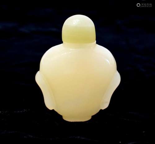 A Chinese White Jade Opaque Snuff Bottle, with a Celadon Gre...