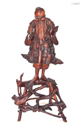 A Large Chinese Wood Carving of an Immortal,