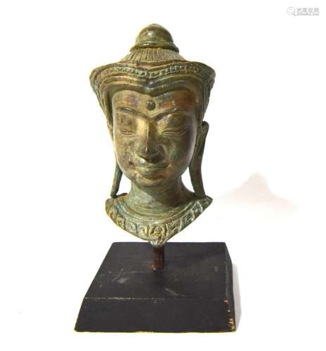 A Bronze Cambodian Buddha Head on a Stand