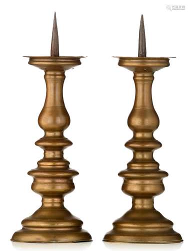 (T) A pair of Baroque pricket candlesticks, the