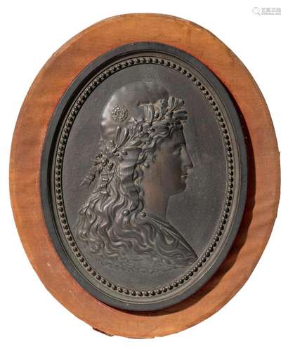 (T) A basso-relievo patinated bronze plaque of