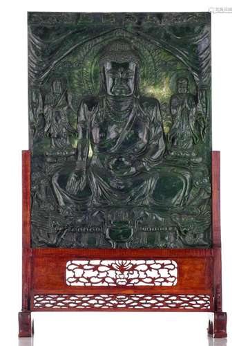 (T) A Chinese dark green jadeite 'Buddhist' carved