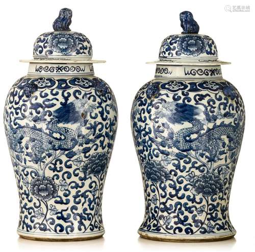 (T) A pair of blue and white covered vases, finely