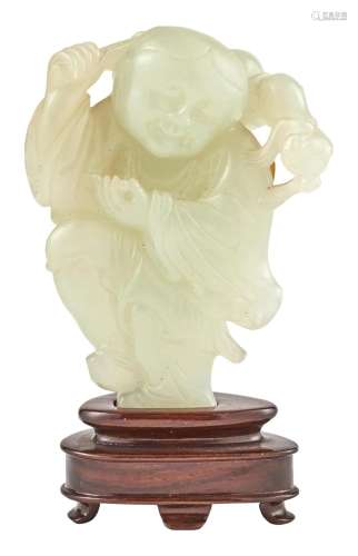 A Chinese Light Celadon Jade Figural Carving