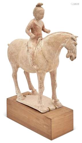 A Chinese Pottery Figure of a Horse and Rider