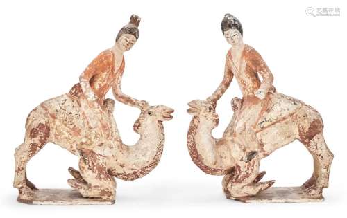 A Pair of Chinese Painted Pottery Models of Camels and Rider...