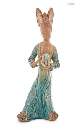A Chinese Blue Glazed Pottery Figure of a Woman Musician wit...