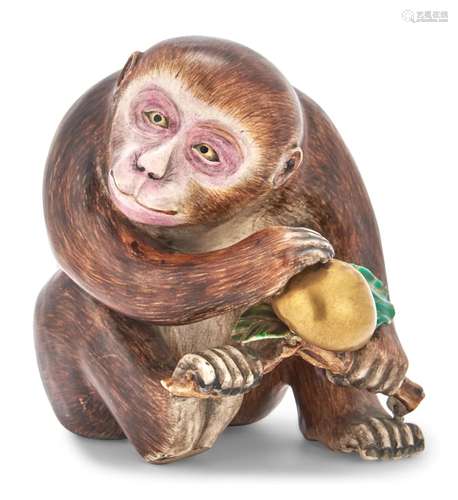 A Japanese Satsuma Earthenware Figure of a Monkey