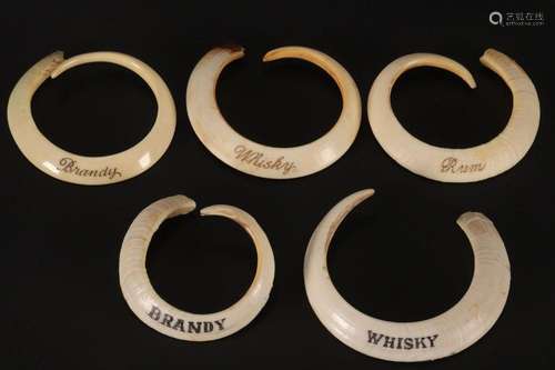 Quantity of 19th Century Boar Tusk Decanter Labels