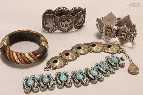 Four Costume Bracelets and a Bangle,