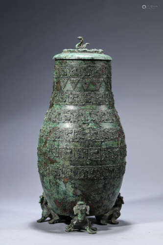 A Chinese Bronze Beast Tripot Vase and Cover