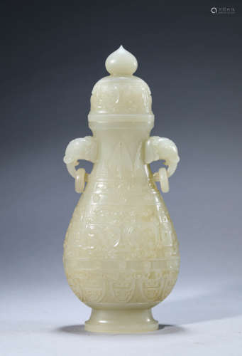 A Chinese Jade Taotie Mask Vase and Cover