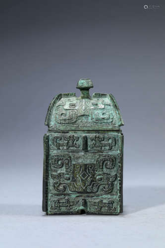 A Chinese Bronze Taotie Vase and Cover Yi