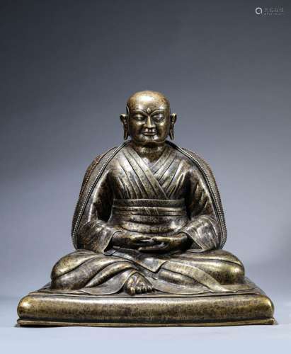 A Chinese Bronze Guru Statue