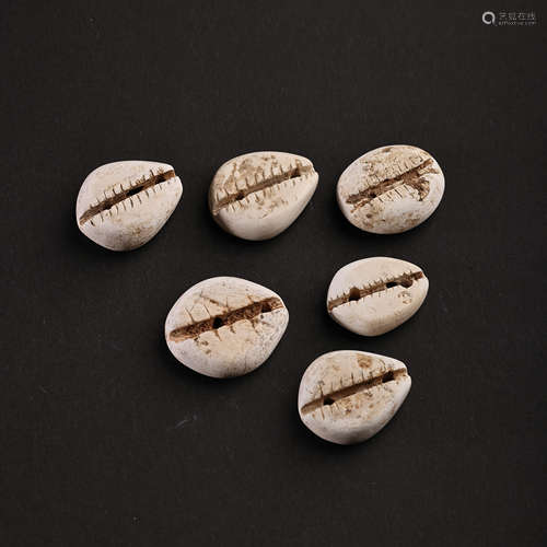 A SET OF CHINESE HONGSHAN PERIOD CHICKEN BONE JADE COINS