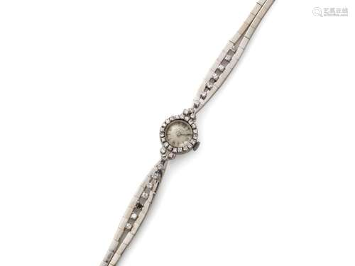 52. Bracelet montre de dame en or gris (750/1000e). Mouvemen...