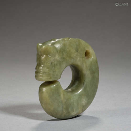 An important celadon and russet jade 'pig-dragon', zhulong N...