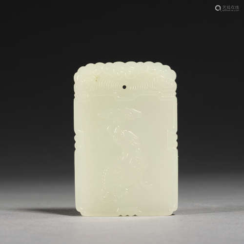 A white jade 'auspicious beast' plaque, Qing dynasty