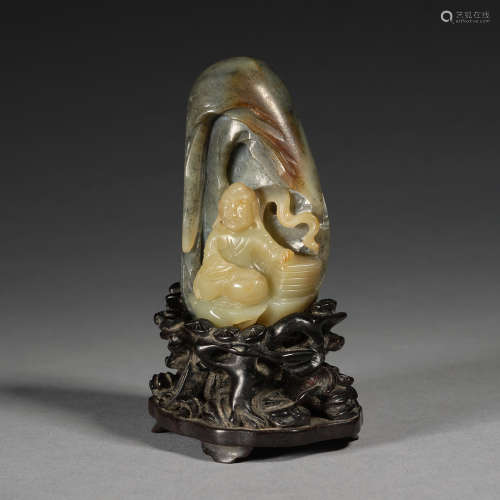 A rare black and celadon jade 'buddha' mountain with wooden ...