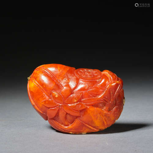 An amber 'Lotus root, lotus flower and lotus leaf' carving Q...