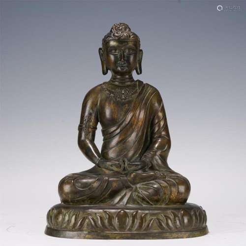 A CHINESE ALOESWOOD CARVED SHAKYAMUNI