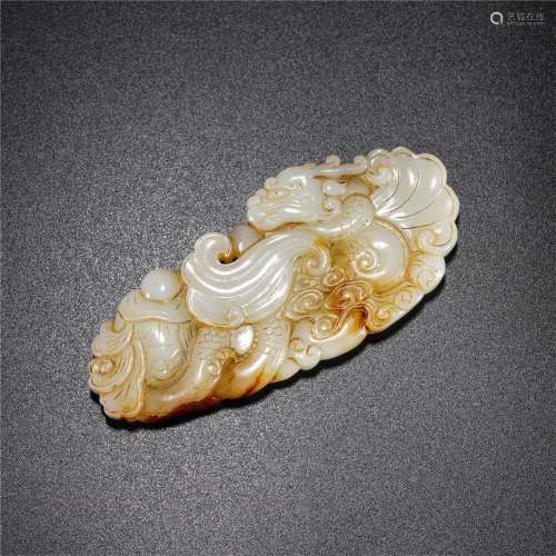A CHINESE CARVED DRAGON-FISH JADE PENDANT