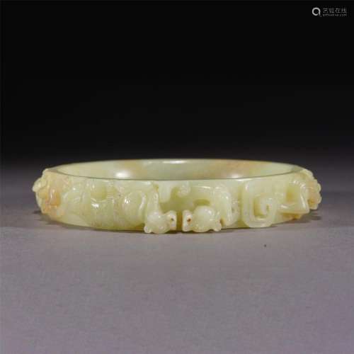 A CHINESE CARVED YELLOW JADE ARM RING