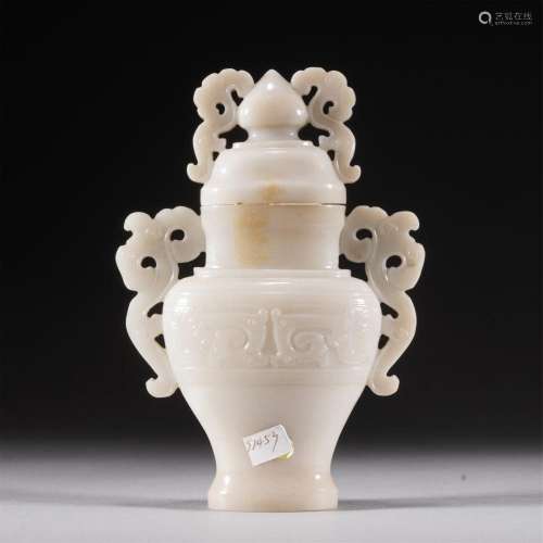 A CHINESE CARVED JADE VASE WITH COVER AND HANDLES