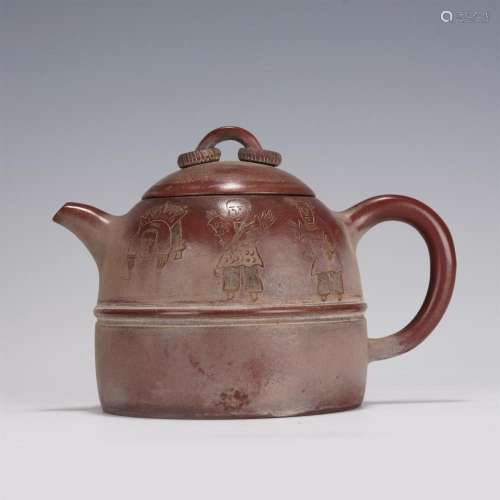 A CHINESE CARVED FIGURAL PATTERN YIXING CLAY TEAPOT