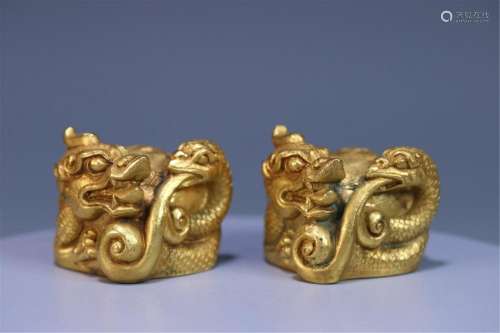 A PAIR OF CHINESE GILT BRONZE XUANWU PAPER WEIGHT