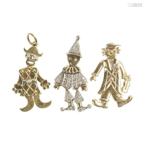 Three Diamond, Yellow Gold Clown Pendants.