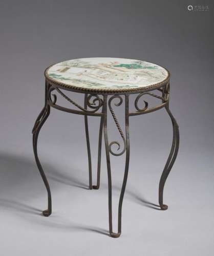 Chinese Art An iron mounted table with a famille rose porcel...