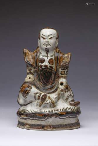 Chinese Art A Cizhou pottery figure of seated Guandì China, ...