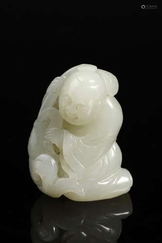 Chinese Art A white jade carving of a seated child China, 19...