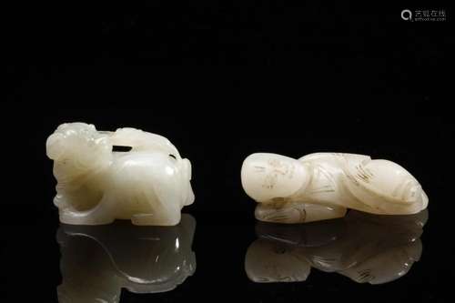 Chinese Art Two jade carvings shaped as a child and a lion C...