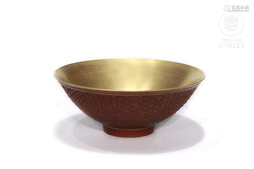 Carved and red-glazed porcelain bowl, Qing dynasty.