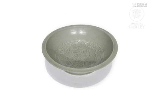 Yue-style ceramic dish with celadon glaze.