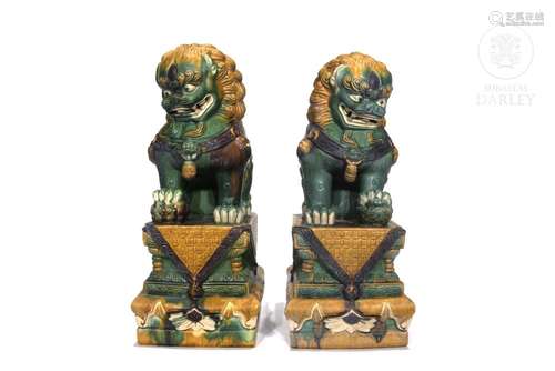 Pair of glazed ceramic lions, 20th century