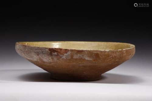 . An earthenware bowl incised with central sun Middle East o...