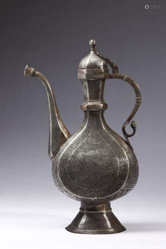 Islamic Art A large metal ewer (aftaba) engraved with scroll...